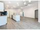 Spacious open concept kitchen and living room with sleek floors and abundant lighting at 405 Bandon Dunes Loop, Davenport, FL 33837