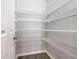 Walk-in pantry with door and wire shelving to help keep your dry goods organized at 405 Bandon Dunes Loop, Davenport, FL 33837