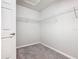 A well-organized walk-in closet with wire shelving and neutral carpeting at 405 Bandon Dunes Loop, Davenport, FL 33837