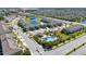 Aerial view of community amenities including a swimming pool and playground at 10849 Wyne Tree Ct, Orlando, FL 32824