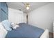 Comfortable bedroom with a soft bed, neutral tones, and a closet, creating a relaxing ambiance at 10849 Wyne Tree Ct, Orlando, FL 32824