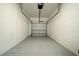 Clean, empty garage space with a white brick wall and neutral-colored flooring at 10849 Wyne Tree Ct, Orlando, FL 32824