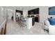 Open concept kitchen with granite countertops, dark cabinets, and island seating at 10849 Wyne Tree Ct, Orlando, FL 32824