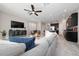 Inviting living room with modern furniture, a large TV, and an open layout to the kitchen at 10849 Wyne Tree Ct, Orlando, FL 32824