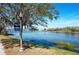 Scenic views of the community's lake, perfect for a relaxing stroll or enjoying nature at 10876 Eclipse Lily Way # 60, Orlando, FL 32832