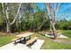 Enjoy outdoor dining at the picnic tables in the community's green space at 10876 Eclipse Lily Way # 60, Orlando, FL 32832
