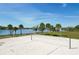 Beach volleyball court with palm trees in the background, perfect for outdoor recreation at 10876 Eclipse Lily Way # 60, Orlando, FL 32832