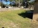 Spacious backyard featuring a well-maintained lawn and a secure wooden fence at 1130 W Minnehaha Ave, Clermont, FL 34711
