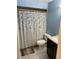 Bathroom featuring a floral shower curtain, toilet and vanity at 1130 W Minnehaha Ave, Clermont, FL 34711