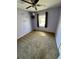 Bedroom with carpet and light purple walls. Natural light and star decor at 1130 W Minnehaha Ave, Clermont, FL 34711