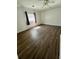 Bedroom featuring laminate flooring, neutral walls, a single window, and ample space at 1130 W Minnehaha Ave, Clermont, FL 34711