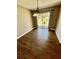 Bright dining room with sliding glass doors to backyard, and modern lighting fixture at 1130 W Minnehaha Ave, Clermont, FL 34711