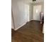 Bright foyer featuring fresh paint and modern wood flooring at 1130 W Minnehaha Ave, Clermont, FL 34711