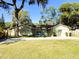 Charming single-story home with a well-maintained lawn, mature trees, and a long driveway at 1130 W Minnehaha Ave, Clermont, FL 34711
