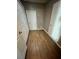 Hallway features wood-look flooring and white doors at 1130 W Minnehaha Ave, Clermont, FL 34711