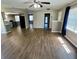 Spacious living room featuring laminate flooring, neutral paint colors, and lots of natural light at 1130 W Minnehaha Ave, Clermont, FL 34711