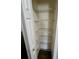 This is an image of a storage pantry with metal shelving and white walls at 1130 W Minnehaha Ave, Clermont, FL 34711