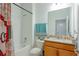 Bright bathroom featuring a shower-tub combo, granite countertop and modern fixtures at 1284 Spotted Sandpiper Loop, Winter Springs, FL 32708