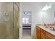 Bathroom with double sink granite vanity and walk-in shower at 1284 Spotted Sandpiper Loop, Winter Springs, FL 32708