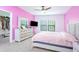 Brightly painted primary bedroom with a ceiling fan, large windows and a walk in closet at 1284 Spotted Sandpiper Loop, Winter Springs, FL 32708
