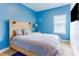 Modern bedroom showcasing an attractive bed frame and a window for natural light at 1284 Spotted Sandpiper Loop, Winter Springs, FL 32708