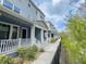 View of the townhome exteriors that showcase the design and community setting at 1284 Spotted Sandpiper Loop, Winter Springs, FL 32708