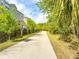 Community path and townhome exterior bordered with beautiful vegetation at 1284 Spotted Sandpiper Loop, Winter Springs, FL 32708