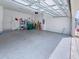 Spacious garage with epoxy flooring, storage shelves and ample room for parking at 1284 Spotted Sandpiper Loop, Winter Springs, FL 32708