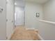 Upstairs hallway features neutral walls, plush carpet and white doors at 1284 Spotted Sandpiper Loop, Winter Springs, FL 32708