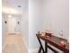 Bright hallway with tile flooring and decorative table, leading to the front door at 1284 Spotted Sandpiper Loop, Winter Springs, FL 32708