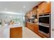 Modern kitchen with stainless steel appliances, granite countertops, and ample cabinetry at 1284 Spotted Sandpiper Loop, Winter Springs, FL 32708