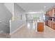 Bright kitchen features stainless appliances and tile floors, seamlessly connects to dining and living areas at 1284 Spotted Sandpiper Loop, Winter Springs, FL 32708