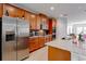Modern kitchen with stainless steel appliances, granite countertops, and ample cabinetry at 1284 Spotted Sandpiper Loop, Winter Springs, FL 32708
