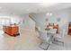 Bright kitchen with an eat-in island bar featuring tile floors and seamlessly connects to dining and living areas at 1284 Spotted Sandpiper Loop, Winter Springs, FL 32708