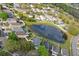 Overhead shot of homes bordering a pond, illustrating a peaceful and interconnected residential community at 13212 Briar Forest Ct, Orlando, FL 32828