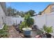 Well-maintained backyard featuring a vertical garden, gardening area, and a privacy fence at 13212 Briar Forest Ct, Orlando, FL 32828
