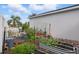 Backyard with a metal garden bed and various potted plants, showcasing gardening opportunities at 13212 Briar Forest Ct, Orlando, FL 32828