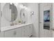 Modern bathroom featuring a double vanity, sleek fixtures, and ample lighting at 13212 Briar Forest Ct, Orlando, FL 32828