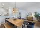 Dining area features a wooden table and bench with an open concept at 13212 Briar Forest Ct, Orlando, FL 32828