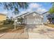 Charming single-Gathering home featuring a well-manicured lawn and two-car garage at 13212 Briar Forest Ct, Orlando, FL 32828