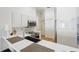 Modern kitchen boasts sleek white cabinetry, stainless steel appliances, and a spacious countertop at 13212 Briar Forest Ct, Orlando, FL 32828