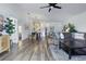 Spacious, open-concept living area with hardwood floors, a comfortable couch, and neutral decor at 13212 Briar Forest Ct, Orlando, FL 32828
