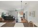 Open floor plan showcasing the dining area, living room, and wood floors at 13212 Briar Forest Ct, Orlando, FL 32828