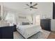 Serene main bedroom with a plush bed, neutral tones, and a ceiling fan at 13212 Briar Forest Ct, Orlando, FL 32828