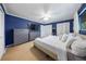 Spacious bedroom with blue walls, neutral carpet, and ceiling fan at 13224 Casper Ln, Clermont, FL 34711