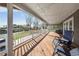 Spacious outdoor deck with string lights and comfortable seating overlooking the landscaped yard at 13224 Casper Ln, Clermont, FL 34711
