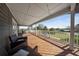 Spacious covered deck with outdoor seating and scenic views at 13224 Casper Ln, Clermont, FL 34711
