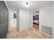 This hallway connects the bathroom, laundry, and bedroom of the home at 13224 Casper Ln, Clermont, FL 34711