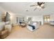 Comfortable living room boasts a neutral color palette, large windows, and a cozy sectional sofa at 13224 Casper Ln, Clermont, FL 34711