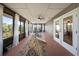 Cozy sunroom with screened windows, ceiling fan, and a play area with a wooden slide at 13224 Casper Ln, Clermont, FL 34711